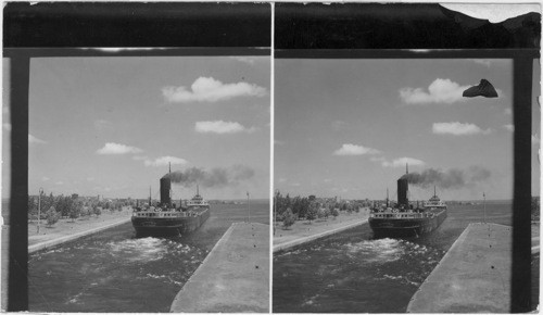 A Lake Ore Boat leaving the locks to enter Lake Huron - The Soo Locks - Michigan