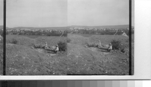 Earth works on Hill of Maximillian's Last Stand. Little church and city in distance. Queretaro, Mexico