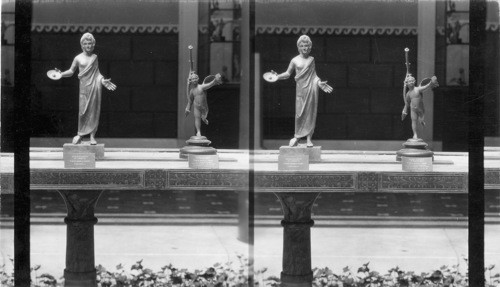 Marble table with Bronze Statuette. Priest at left & Eros at right