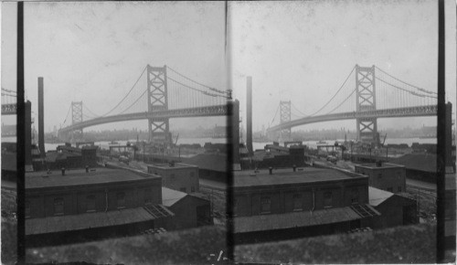 The world's largest suspension bridge which spans the Delaware River connecting Penn & N.J. by Phila. & Camden. Bridge to be officially opened July 4, 1926. Looking south from Camden, N.J. showing Phila. in background