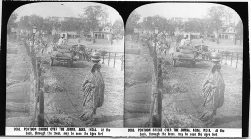 Inscribed in recto: 9063. PONTOON BRIDGE OVER THE JUMNA, AGRA, INDIA. At the back, through the trees, may be seen the Agra fort