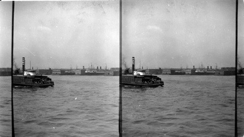 From upper deck of ferry. Looking to great ocean liners at the docks. Hoboken, N.J