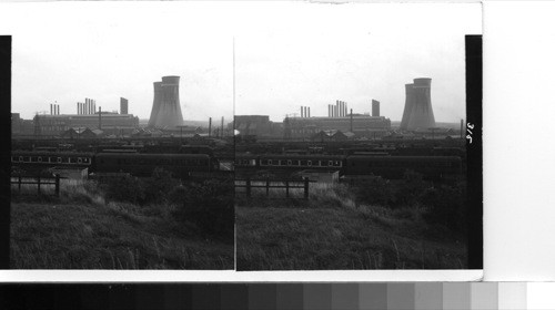 Sheffield: looking put over part of the great industrial area in the steel center surrounding Sheffield. The cooling towers at the right are part of the British electricity corporation whose plants supply power to the steel mills and other industrial plants in this vicinity