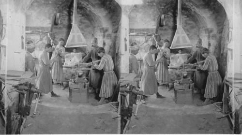 A Blacksmith Scene, Nofa, Mesopotamia. In a metal workers shop