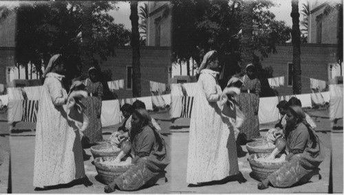 Baking Day in Girls School. A. M. American Mission, Assiut, Egypt