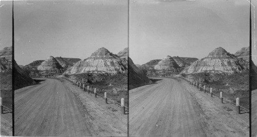 Natural pyramids in the Bad Lands [Badlands] of North Dakota, on the National Parks Highway near Medora