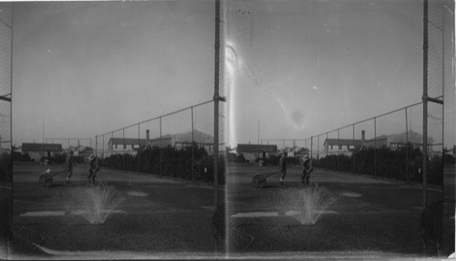 Groundsmen working on tennis court. Iroquois Falls, Ont. Irrigation