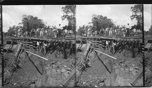 Repairing a wash-out on the Panama Railway at Empire. Panama Canal