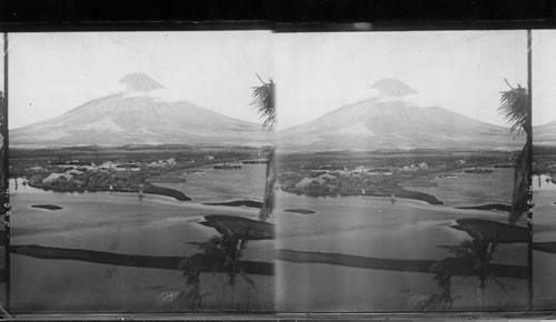 Legaspi [Legazpi], a seaport town of Southern Luzon at the foot of majestic, Mayon (8274 ft. high) P.I's. (Mayon Volcano - E. E. Baker)