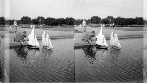 Boys sailing their little yachts in the Reflecting Pool, Wash., D.C