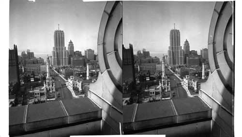 Title: Palmolive Tower - Looking north on Mich. from Chicago. Water Tower in foreground. Remarks: The new Lindbergh Light shows a top the tower. Date: Aug 16 - 30 Focal L.: 3 1/2 in F22 Photographer: Dare Photographer's No. 121