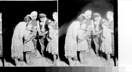 A fisherman and his family gathering moths for bait near Rheims, France