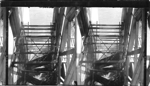 Interior of fish wheel showing basket which scoops out the fish, Columbia River