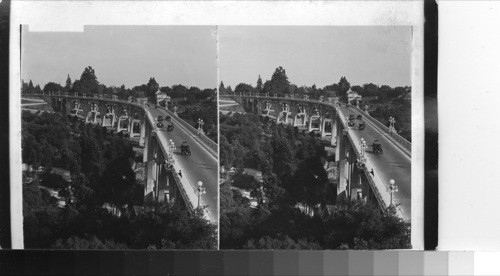 Motoring over a viaduct in one of Pasadena's resident districts. California