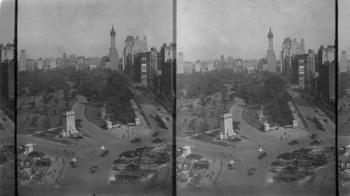 From Manufacturers Trust Bldg. at Columbus Circle and Broadway looking East along 59th St. and Central Park. Monument in Foreground to Learmen who died on Maine