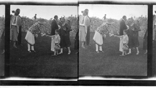 Even the little tots are not forgotten by Mrs. Coolidge, she shakes hands with all, Pres. Coolidge is standing to her right. South Dakota