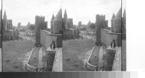 The south walls of the Cite', Carcassonne. Cathedral on left and amphitheater below. Carcassonne. France