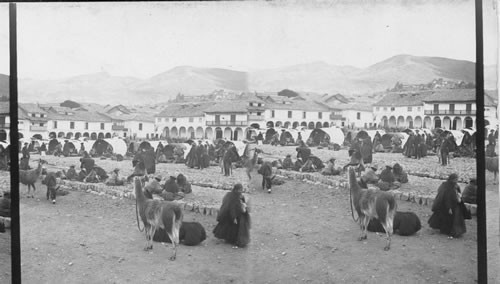 Selling potatoes in their native land - market before Jesuit Church and college. Cuzco. Peru