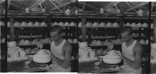 Making cream soup cups, worker is removing the surplus "slip" Lenox Inc." makers of fine china ware, Trenton, N.J