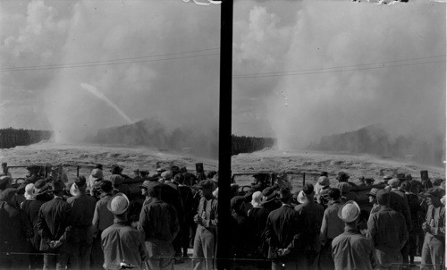 Pres. and Mrs. Harding watching "Old Faithful". Yellowstone Nat. Park