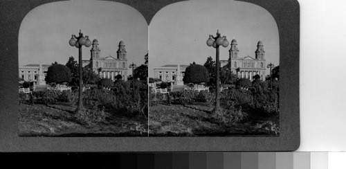 The cathedral spires from across a corner of the parque central. this is the largest church edifice in the central America. Its building had been begun before the earthquake of 1931 but its completion became part of the construction of the new city, which rose from the site of the old one which was almost demolished by that disaster. Managua, Nicaragua, C.A