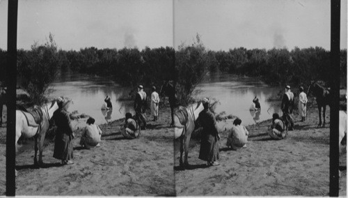 Baptizing in the Jordan. Palestine