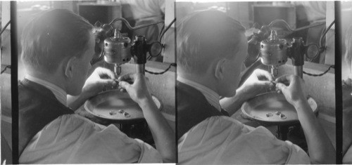 Drill press, drilling very small holes in the pattern of an engagement ring. Jable Ring Co., Newark, N.J