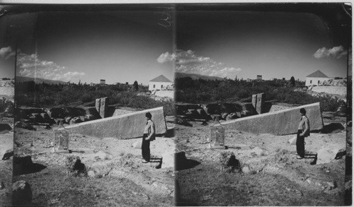 The big stone in the quarries at Baalbek showing the Temple ruins in the background, Syria