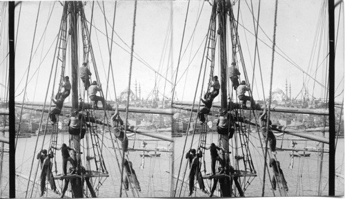 Domes and minarets of Stamboul from rigging of ship at anchor. Constantinople Tour. Turkey