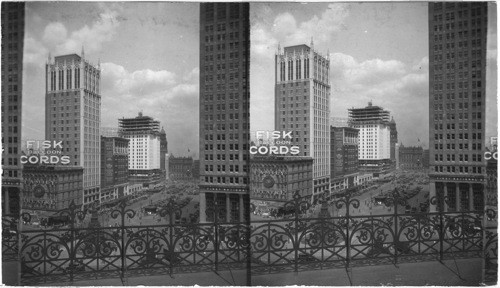 East from City Hall to "Campus Martins" and Cadillac Square, Co. Court House in district background - at right is First National Bank and Central savings Bank, Detroit, Mich