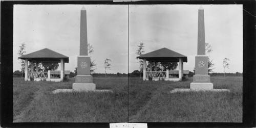 State Park, San Felipe, Texas, Monument of Stephen F. Austin with bandstand & replica of Stephen F. Austin home in background