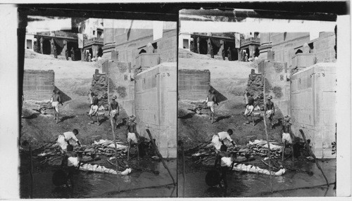 Panch Ganga Ghat - Benares (bathing bodies before burning them). India