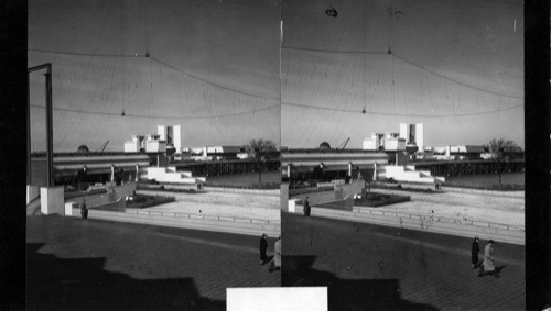 Wide separation across court of the Hall of Science Buildings, Century of Progress. Planetarium and States Bldg. in the background. Taken while grounds are still under construction