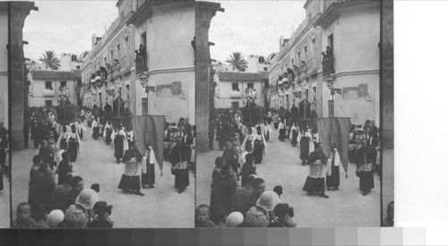 A religious procession outside the walls of the Mesquita. Cordoba, Spain