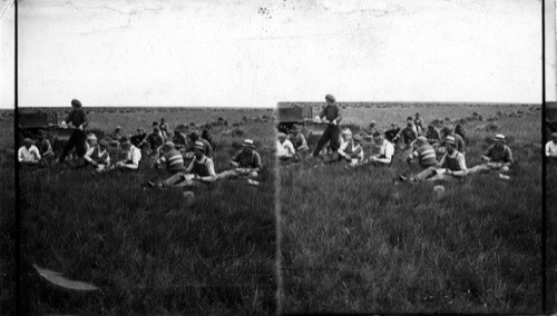 A group of "stookers" who come from all parts of the world to help harvest Canada's wheat crop. Canada. Sask