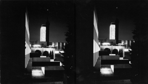 Night view of the Hall of Science Carillon Tower. From the top of this tower flashes the great searchlight which relays the light impulse from the star Arcturus and lights all of the display groups