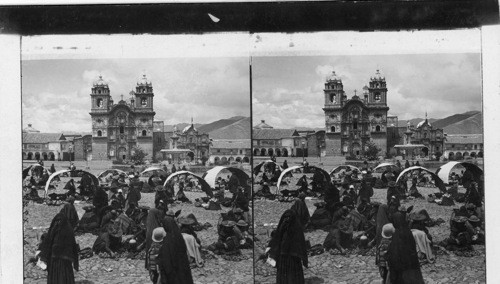 Selling potatoes in their native land - market before Jesuit Church and college. Cuzco. Peru