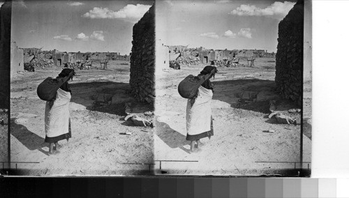 A Hopi water carrier, having no water works or pumps the Hopi still has to carry his water from the spring or well below Mesa, Ariz