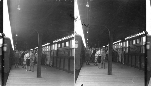 "L" Station platform, train and passengers. Brigandi. No box number