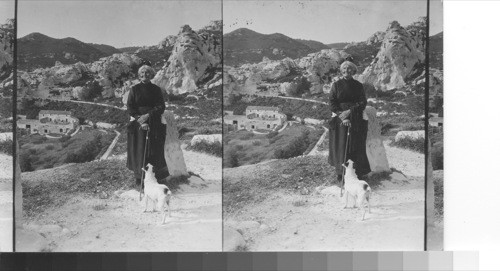 The old guide and her pet, Les Baux, France. (Near Arles)