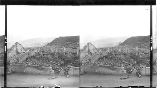 The Wrecked City of St. Pierre, - scene of the most horrible disaster of modern times, smoking Mont Pelee in the background. Martinique, Lesser Antilles