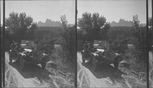 From highway S.E. to "Castle Crags". In foreground in auto returning from hunting deer. Zion National Park. Utah