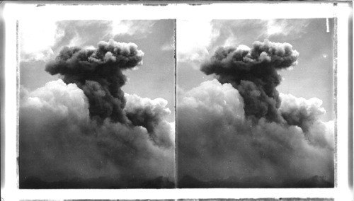 Enormous smoke column, three miles high, mushrooming above terrible Mont Pelee, eruption June, 1902