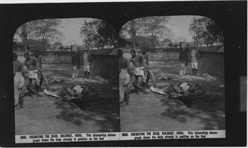 Inscribed in recto: 9006. CREMATING THE DEAD, KALIGHAT, INDIA. This interesting stereograph shows the body already in position on the fuel