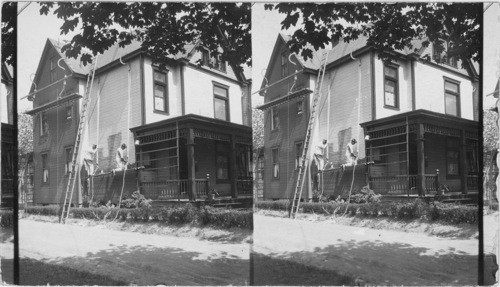 Painters at Work on a House