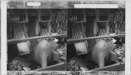 Gigantic crusher and spouts feeding it with iron ore from the mine. Escanaba. Michigan