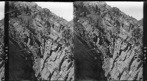 Baldwin making record tightrope walk over gorge. Length 582 feet, height 555 ft. El Dorado Springs, Colo. [Photographer: Edwin Tangen, Boulder. Circa 1908-10]