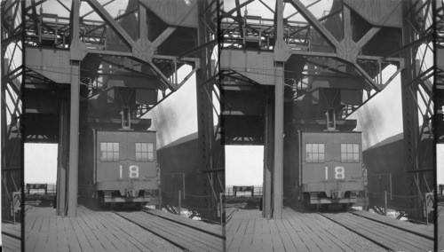 Coal Pier at Sewell's Point, Norfolk, VA. Shows conveyer car on their hopper being filled with coal