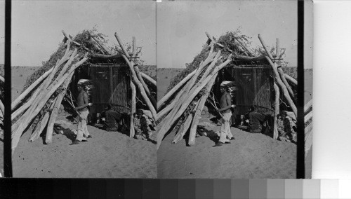 Navaho Blanket Weaving - An Indian Hogan (hut) on the Navajo Reservation, Arizona