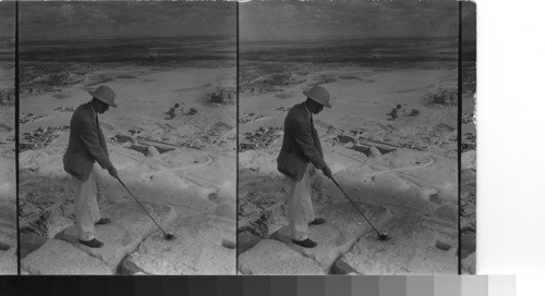 Playing into a sand trap. Summit of Cheops, Gizeh, Egypt